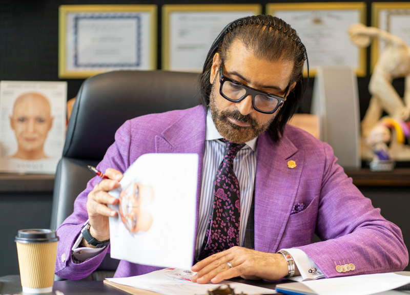 Dr Sherif Wakil completing paperwork