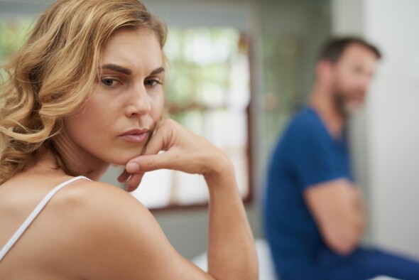 Woman turning away from partner mid argument