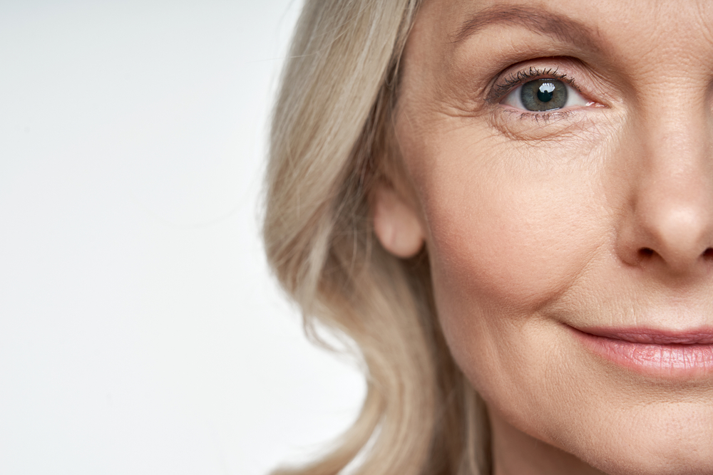 Attractive mature woman with ageing skin and crows feet